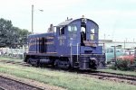 A mechanic works on Texas Oklahoma & Eastern SW900 D4